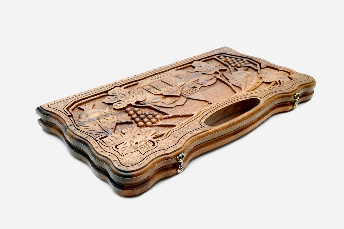 The walnut backgammon board opened to the full 60 cm playing field
