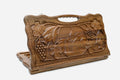 Carved walnut Armenian backgammon board with Geghard Monastery and a cut-out carry handle, propped open