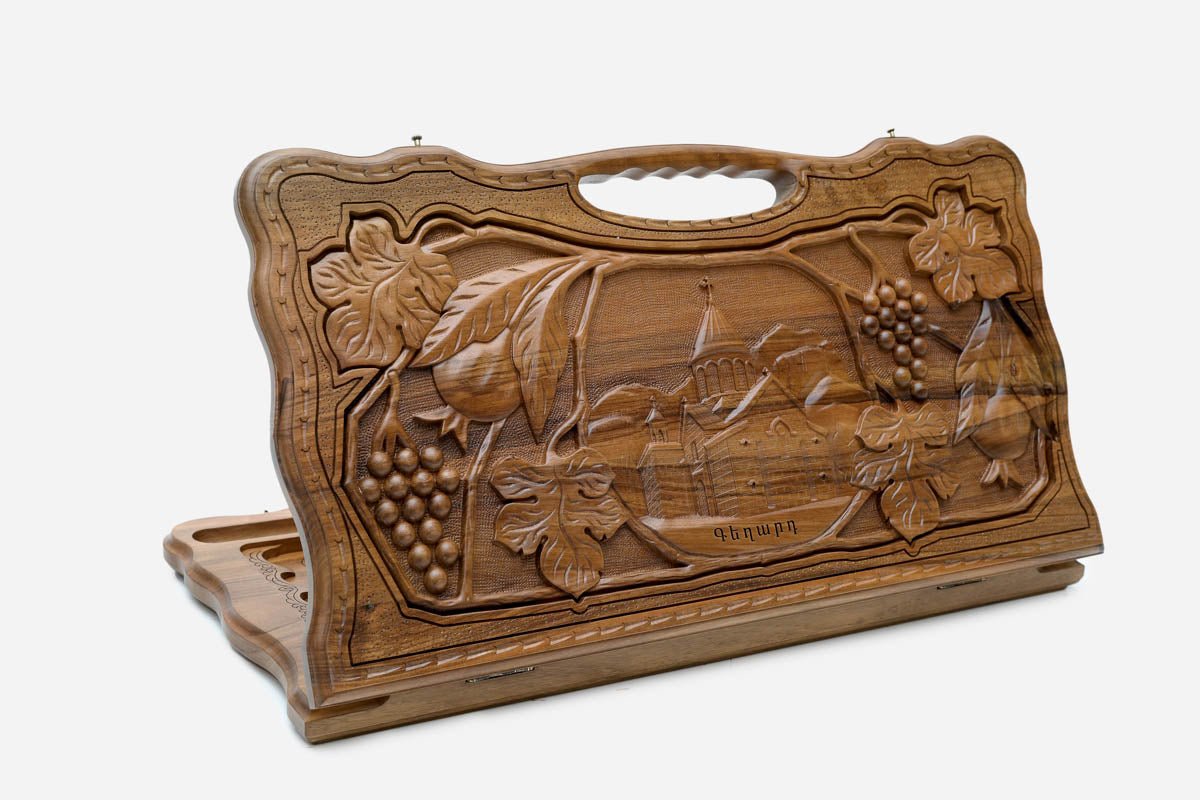 Carved walnut Armenian backgammon board with Geghard Monastery and a cut-out carry handle, propped open