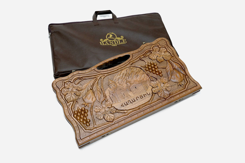 Close-up of the walnut grain and the depth of the carving