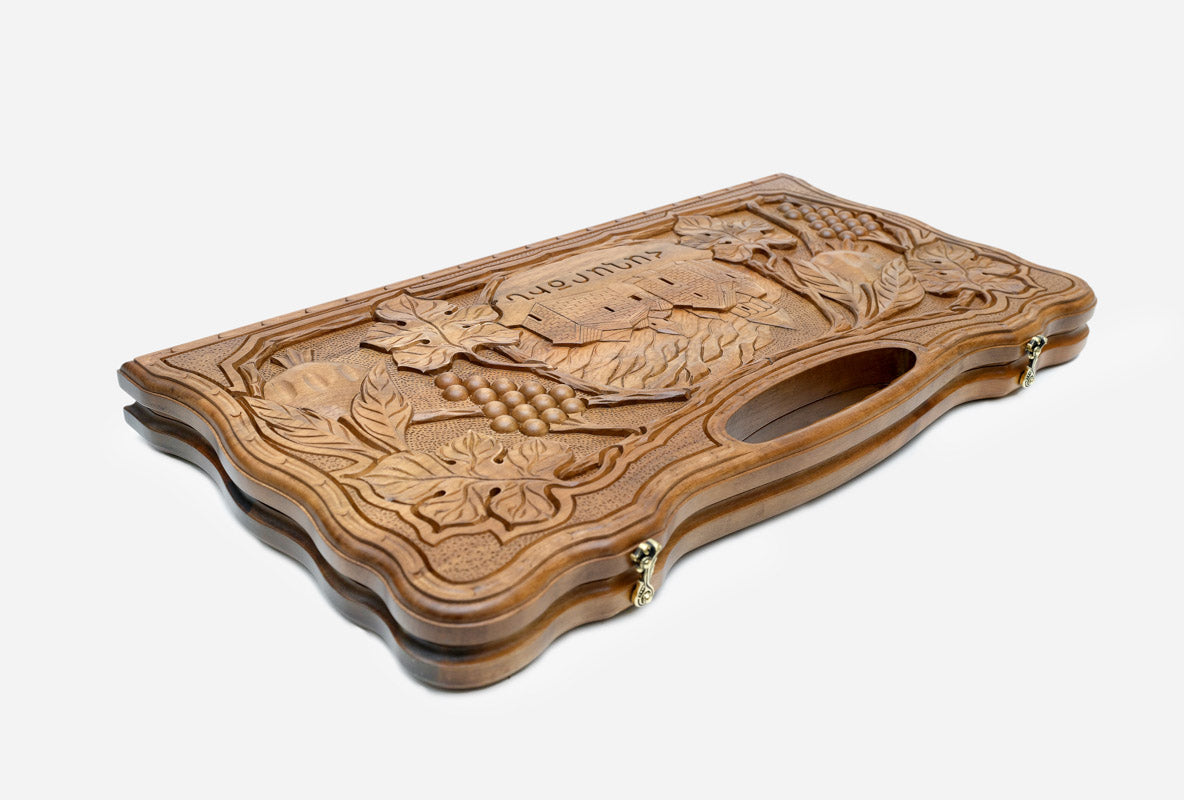 The walnut backgammon board opened to the full 60 cm playing field
