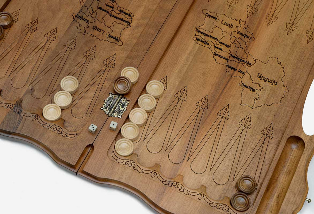 Side view of the folded walnut board showing its bronze hinges