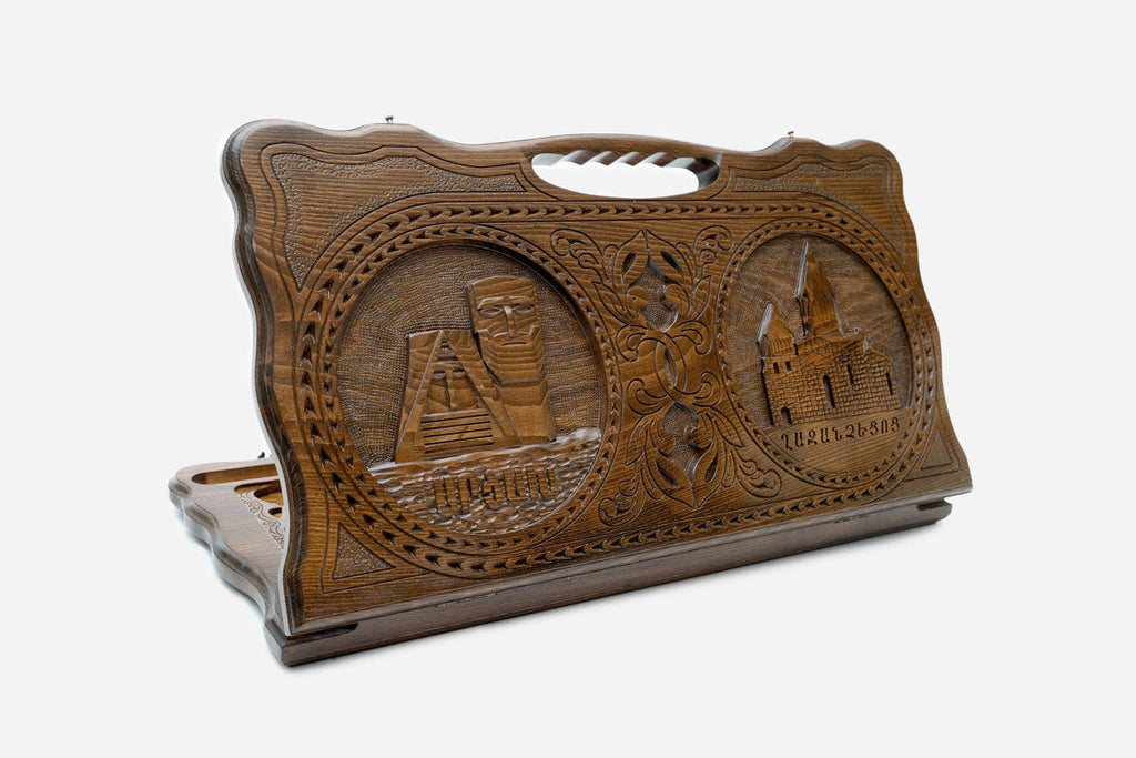 Carved Armenian backgammon board with two landmarks of Artsakh and a cut-out carry handle, propped open