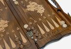 Side view of the folded board showing its bronze hinges and clasps