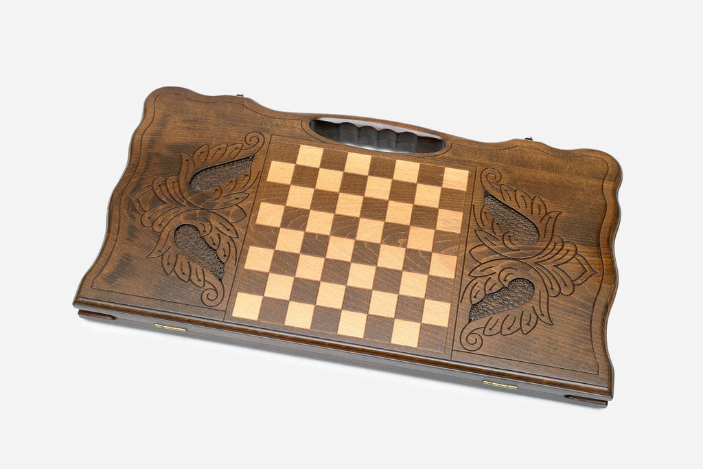 The cut-out carry handle and the upper carving of the lid