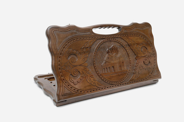 Carved Armenian backgammon board honouring Saint Grigor Narekatsi, with a cut-out carry handle, propped open