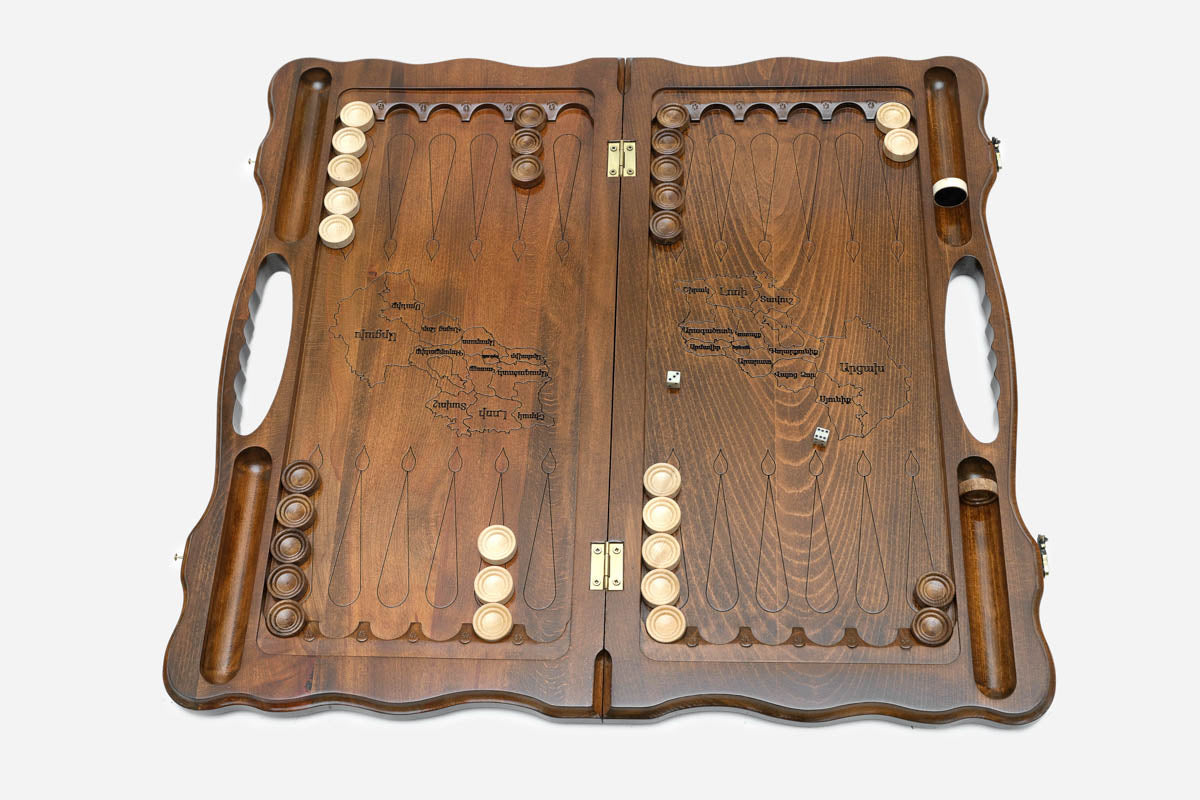 Side view of the folded board showing its bronze hinges and clasps