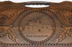 The cut-out carry handle and the upper carving of the lid