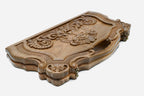 The cut-out carry handle and the upper carving of the lid