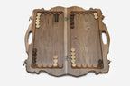 Side view of the folded walnut board showing its bronze hinges