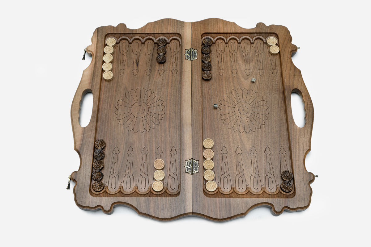 Side view of the folded walnut board showing its bronze hinges