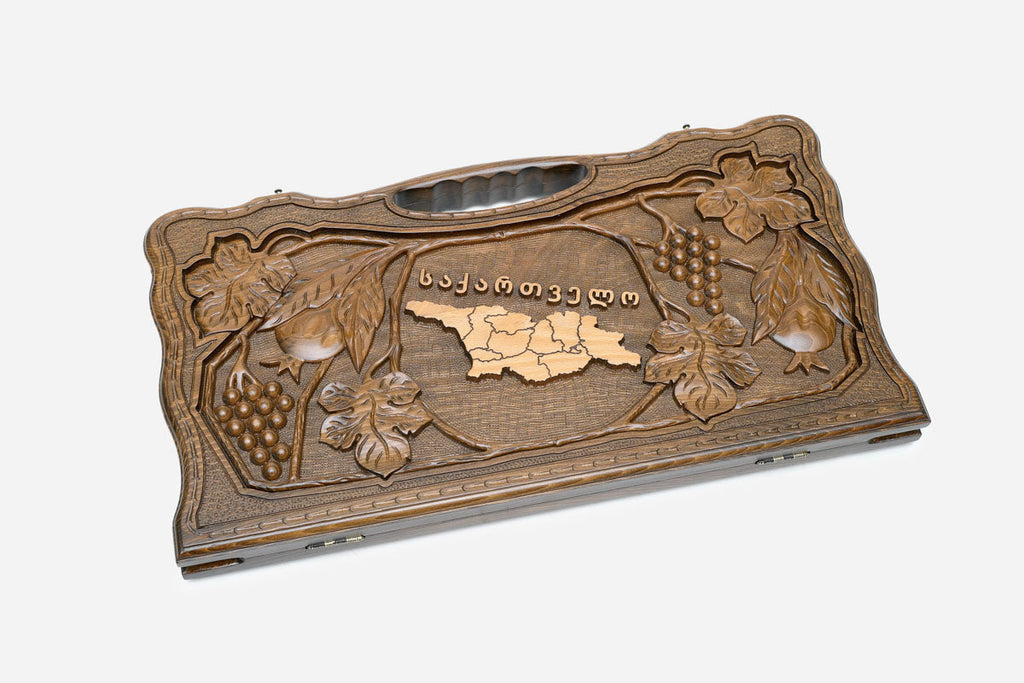 Angled view of the luxury Georgian backgammon set showing the richly carved lid