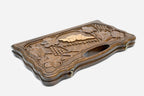 The cut-out carry handle and the upper carving of the lid