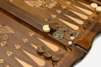 Side view of the folded board showing its bronze hinges and clasps