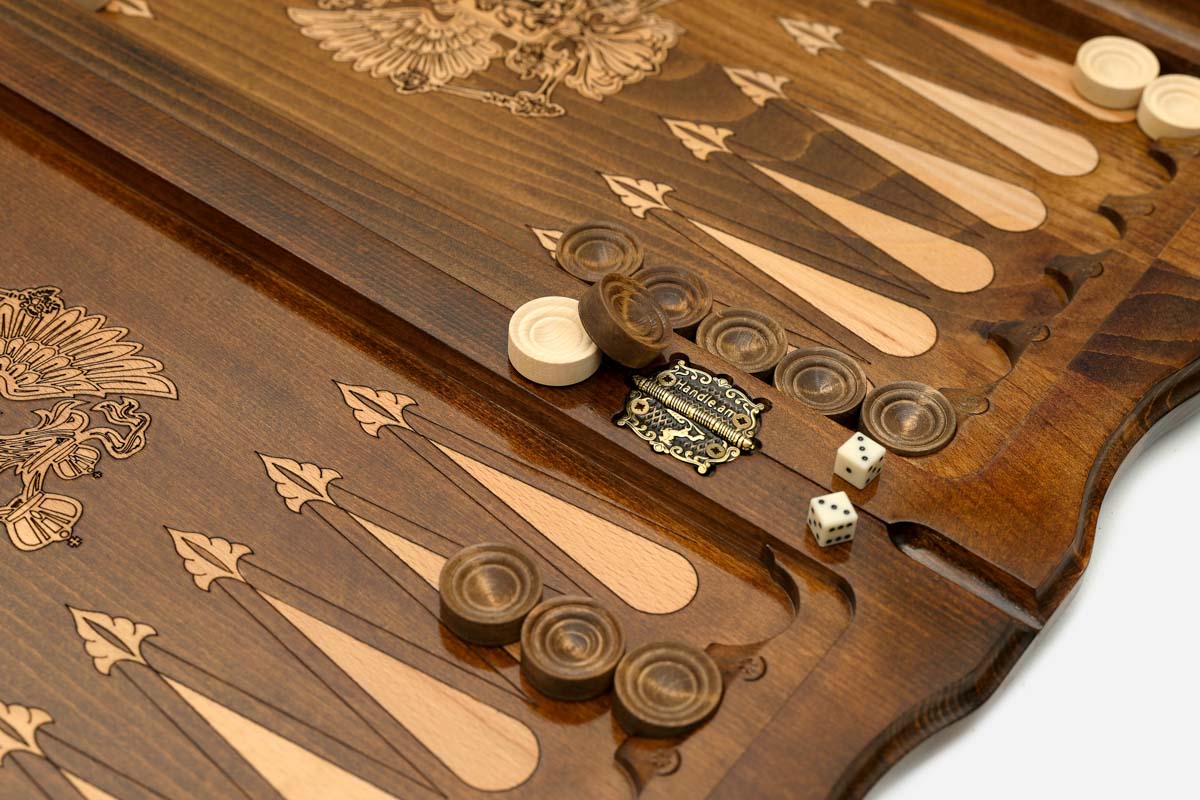 Side view of the folded board showing its bronze hinges and clasps