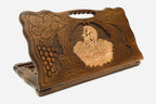 Carved wooden backgammon board with Samson and the lion and a cut-out carry handle, propped open