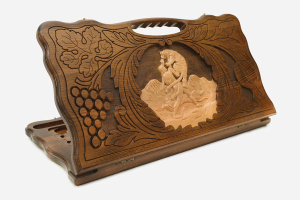 Carved wooden backgammon board with Samson and the lion and a cut-out carry handle, propped open