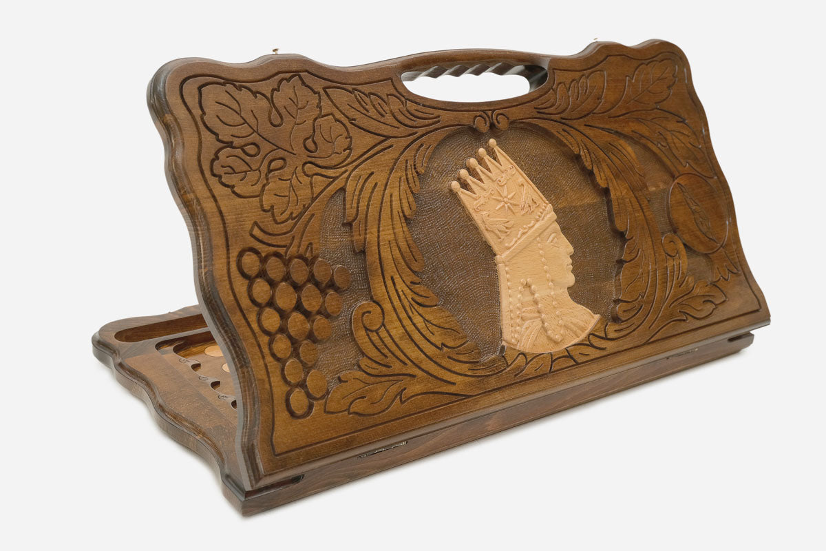 Carved Armenian backgammon board with Tigran the Great crowned in profile, cut-out carry handle, propped open