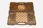The cut-out carry handle and the upper carving of the lid