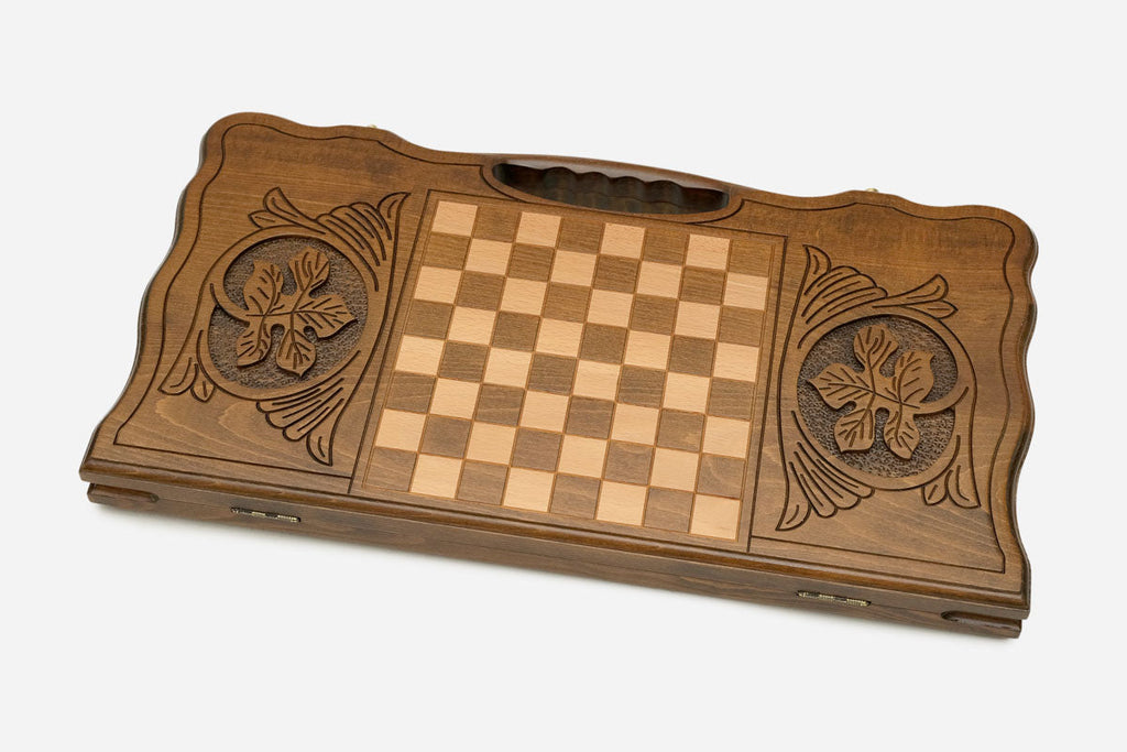 Angled view of the handmade Georgian backgammon set showing the carved lid
