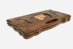 The cut-out carry handle and the upper carving of the lid
