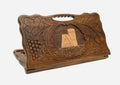 Carved Armenian backgammon board with the We Are Our Mountains monument in a border of grapevines, cut-out carry handle, propped open