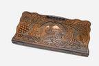 Angled view of the handmade Armenian backgammon set showing the carved landscape