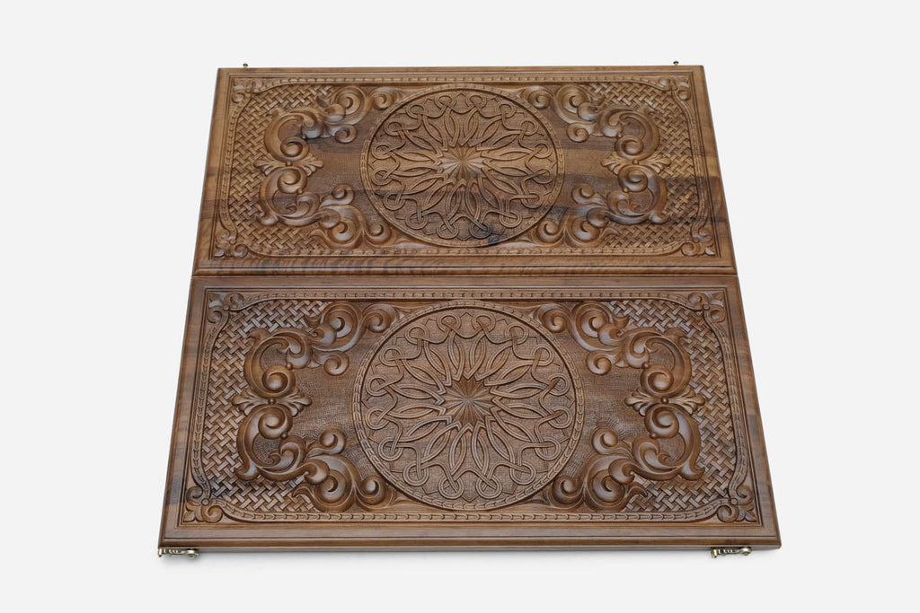 Carved ornament backgammon set shown folded with bronze hinges and clasps