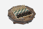 The full octagonal green epoxy chess board with light and dark pieces in starting position