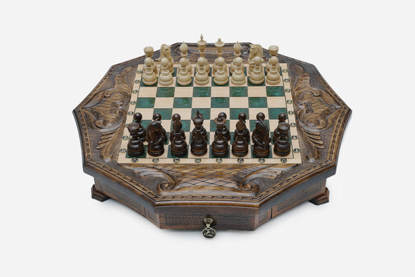 Octagonal chess set with storage, emerald-green epoxy squares and turned wooden pieces set up for play