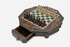 Angled view of the green epoxy board framed by its carved eagle corner reliefs
