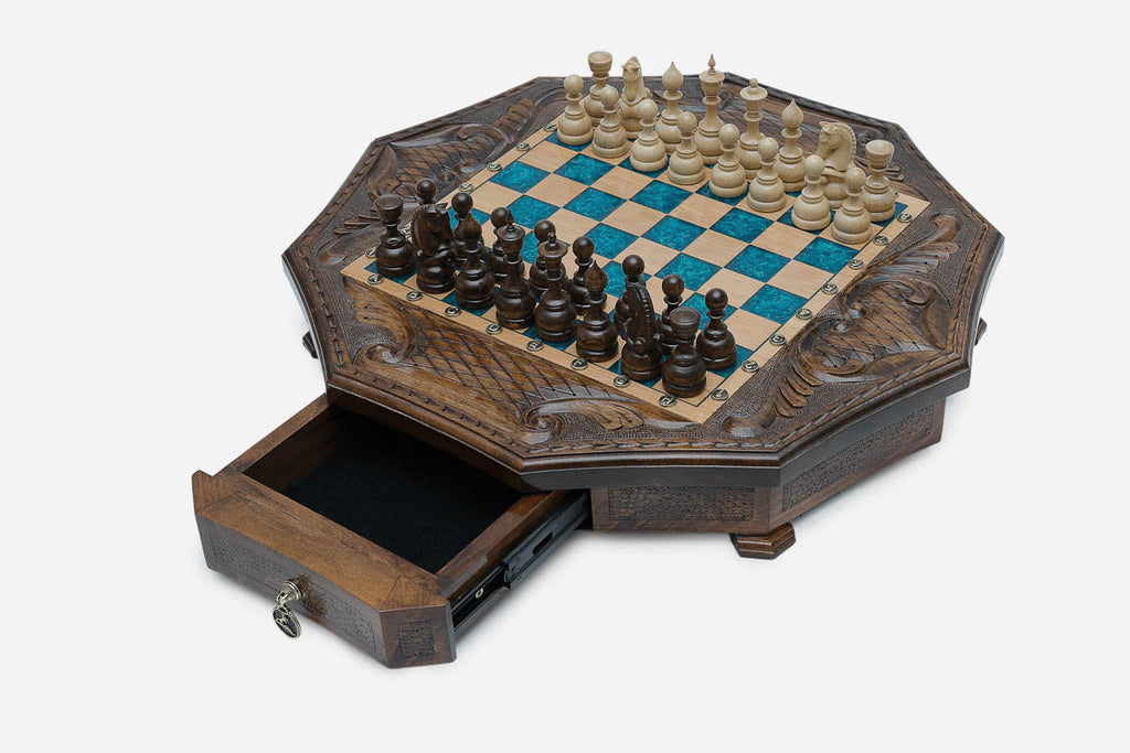 The storage drawer pulled open, showing its black felt lining and brass pull