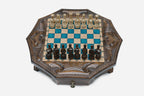 The full octagonal blue epoxy chess board with light and dark pieces in starting position