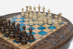 Detail of the carved scrollwork frame surrounding the blue epoxy playing surface