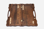 Side view of the folded board showing its bronze hinges and clasps