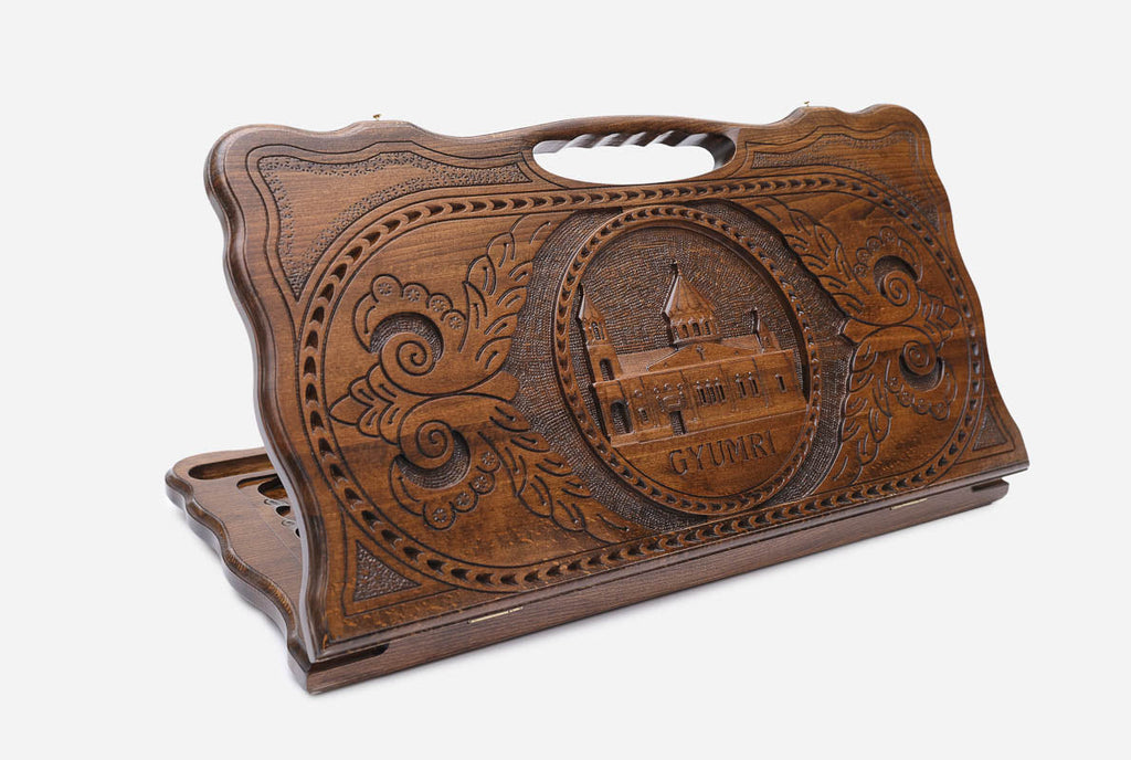 Carved Armenian backgammon board with the Holy Mother of God Cathedral of Gyumri and a cut-out carry handle, propped open