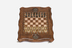 Overhead view of the carved board with cast-metal warrior pieces and bronze Tree of Life inlays
