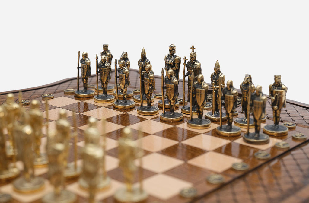 Detail of the cast-metal armies facing off across the diamond-carved board