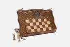 Folding chess backgammon set partly closed, shown with its figural metal pieces and carrying bag
