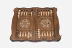 The opened case showing the backgammon layout with its wooden checkers and dice