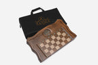 The folded chess backgammon set packed with its carrying bag
