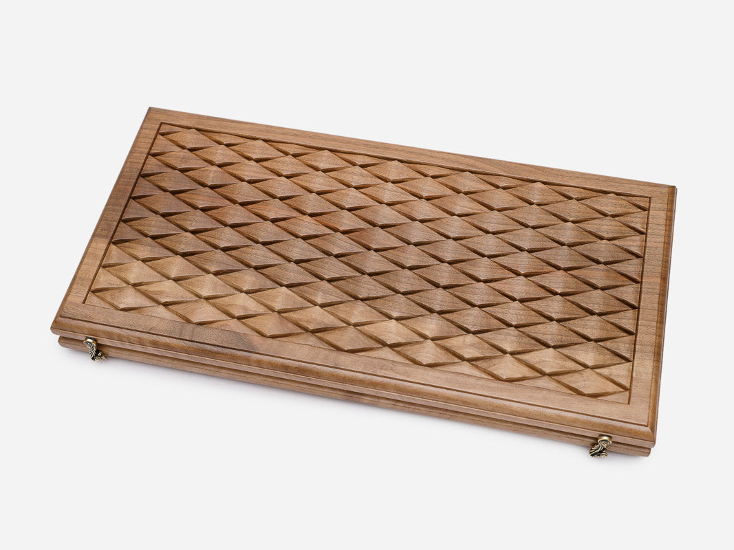 Angled view of the luxury walnut backgammon set showing the carved diamonds
