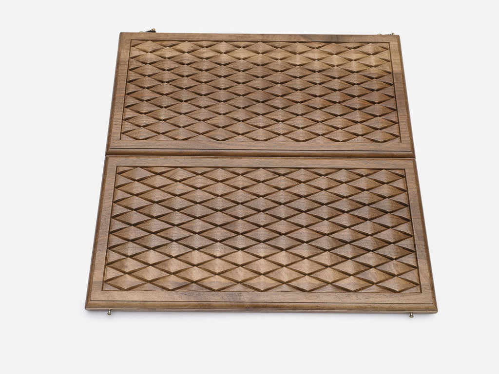 Detail of the geometric diamond relief in walnut