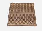 Detail of the geometric diamond relief in walnut