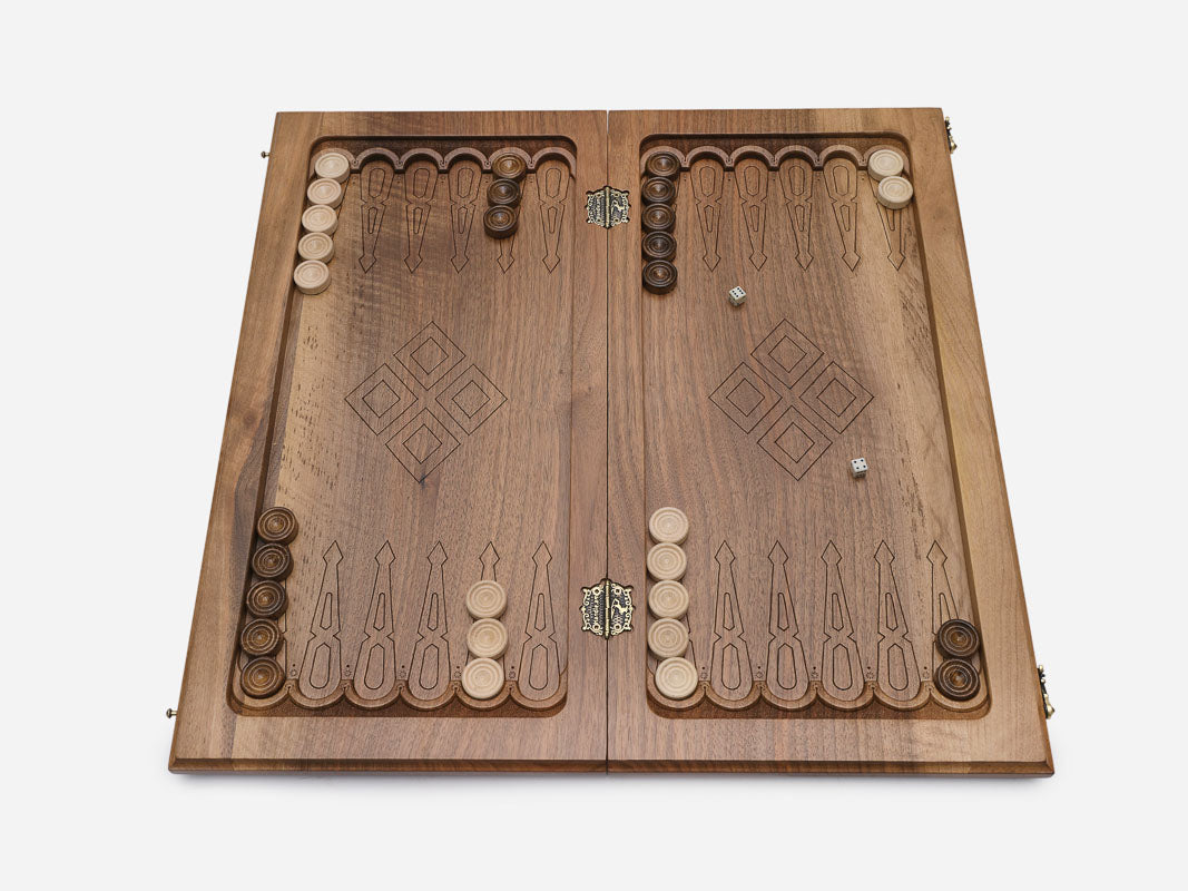 Close-up of the walnut grain and the depth of the diamond carving