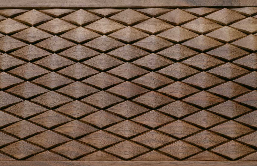 Side view of the folded walnut board showing its bronze hinges