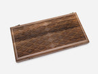 Angled view of the luxury walnut backgammon set showing the carved scales