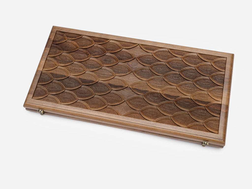 Close-up of the overlapping carved scale pattern