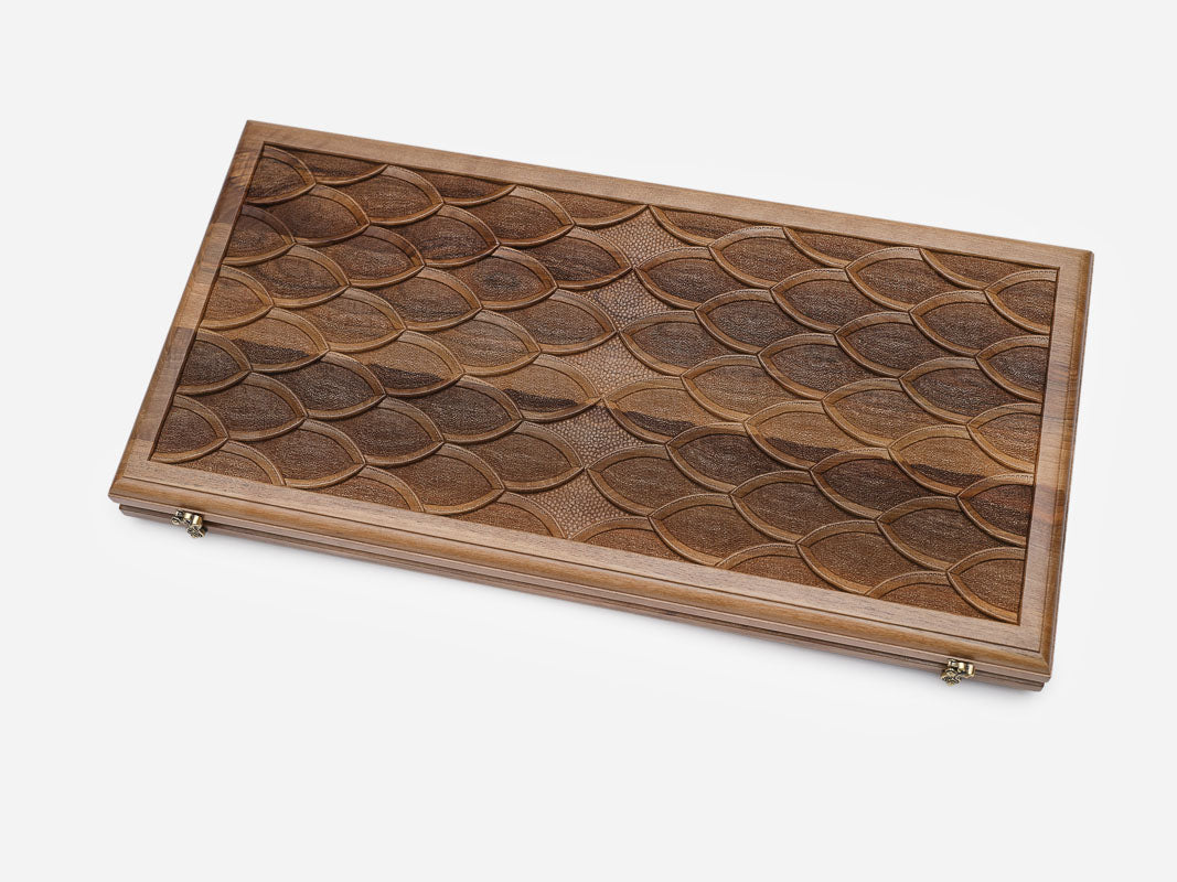 Close-up of the overlapping carved scale pattern