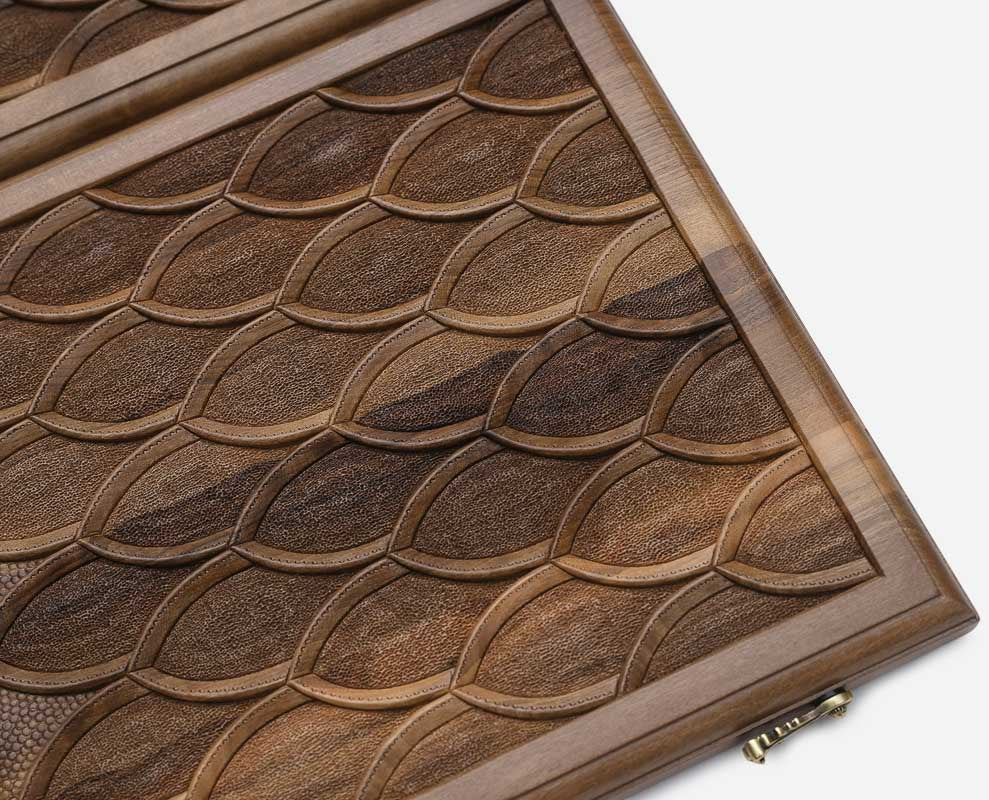 Side view of the folded walnut board showing its bronze hinges